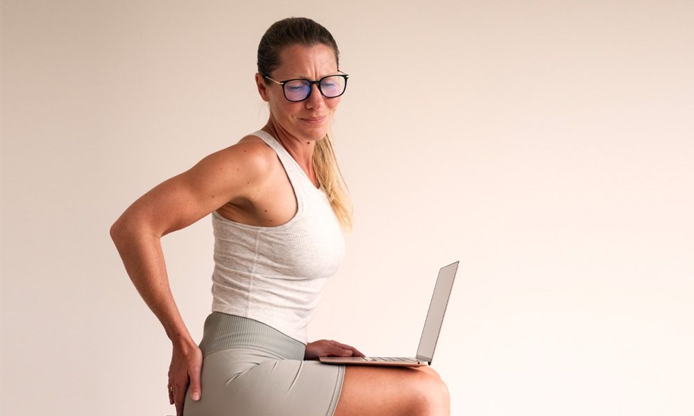 Woman with seated piriformis glute pain
