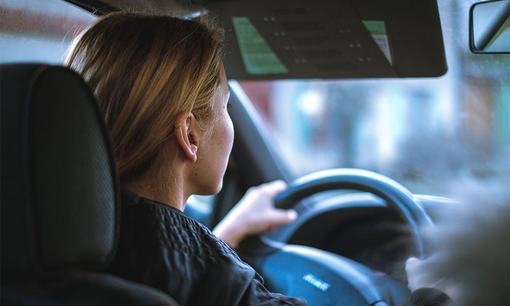 Woman driving in her car